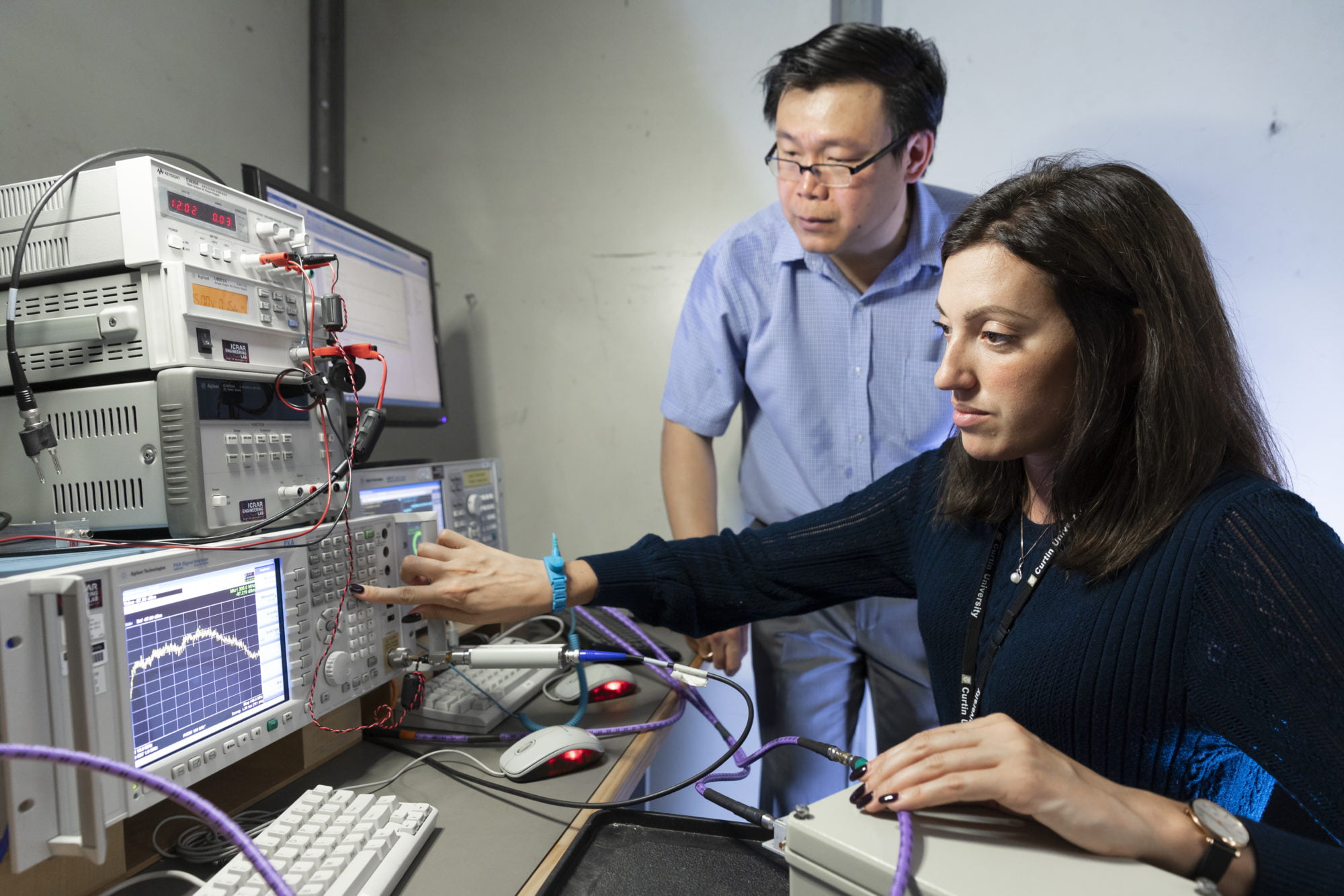Dr Maria Kovaleva and Dr Budi Juswardy characterising a radio frequency device in our RF laboratory.