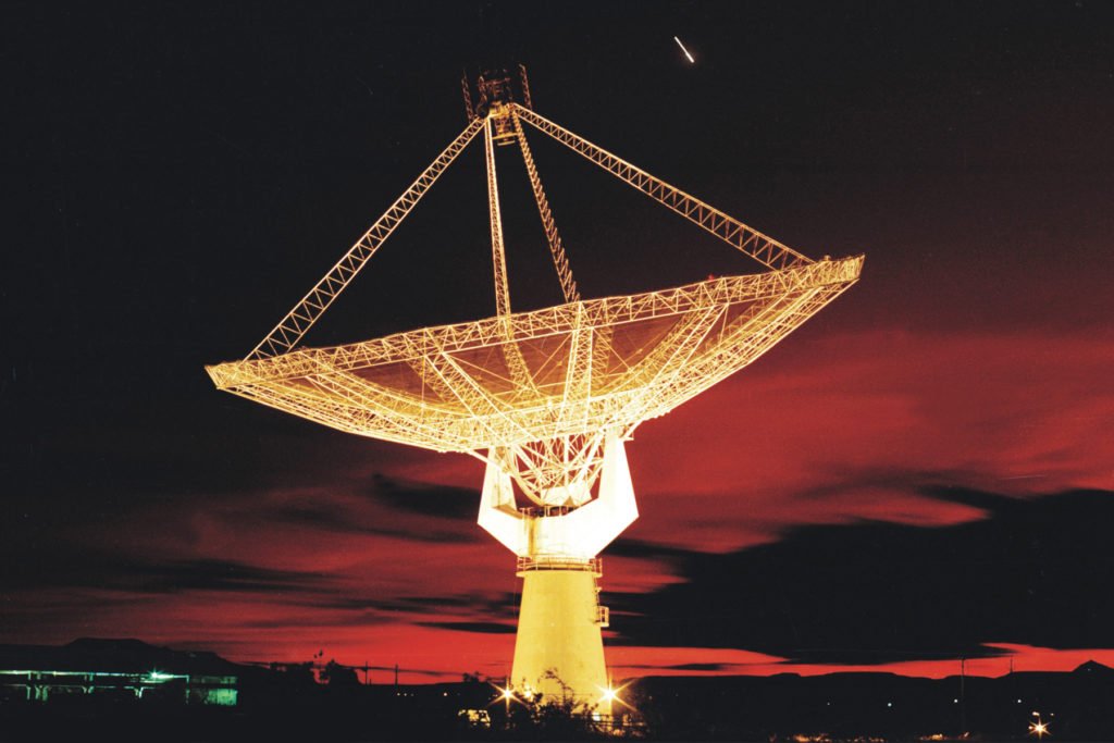 A view of a GMRT antenna lit up at night