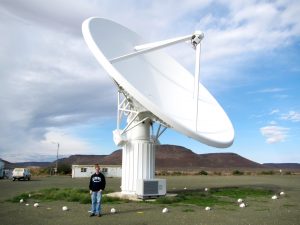 David Gozzard and a the KAT-7 dish at the SKA site in South Africa.