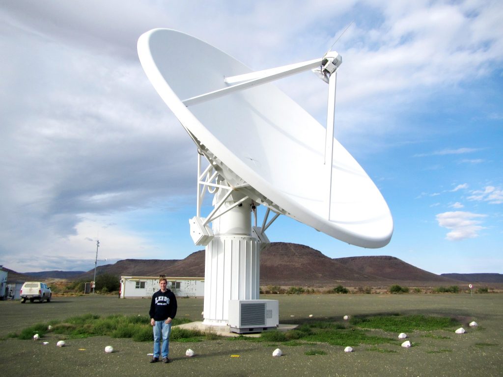 DAVID GOZZARD AND A THE KAT-7 DISH AT THE SKA SITE IN SOUTH AFRICA.