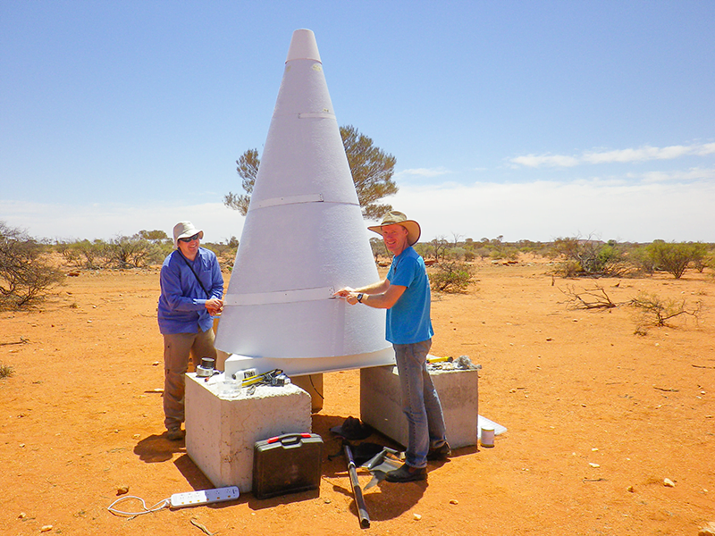 Dr Marcin Sokolowski and Dr Randall Wayth installing the BIGHORNS cone antenna at the Murchison Radio-astronomy Observatory.