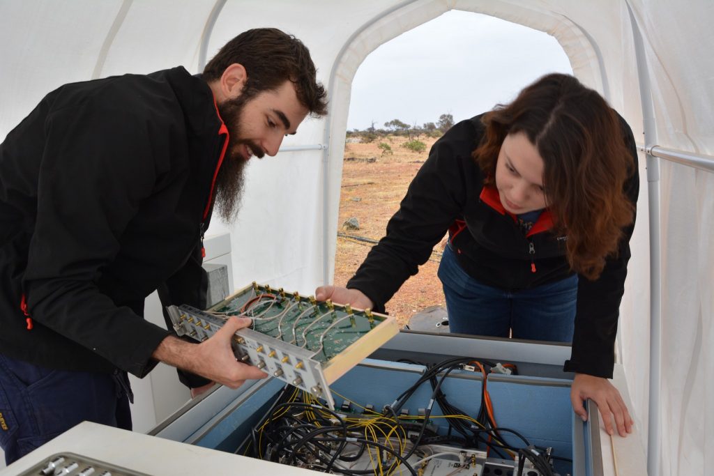 MWA Engineering Intern Mia Walker and Engineering Support Technician Luke Horsley making adjustments to an MWA receiver.