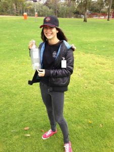 Madeleine with a cloud in a bottle created during water rocket experiments.