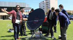 ICRAR PhD Candidate Mehmet Alpaslan explains the Tiny Radio Telescope (TRT) to students during an incursion to Christ Church Grammar School.