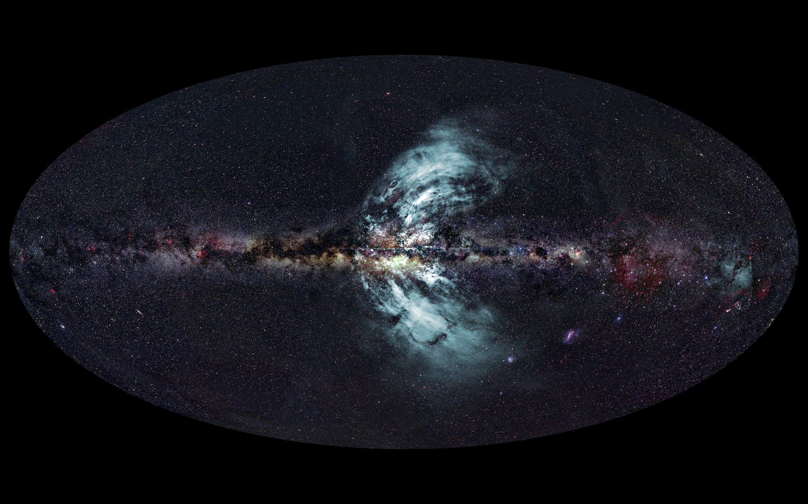 The new-found outflows of particles (pale blue) from the Galactic Centre. The background image is the whole Milky Way at the same scale. The curvature of the outflows is real, not a distortion caused by the imaging process. Credit: Radio image - E. Carretti (CSIRO); Radio data - S-PASS team; Optical image - A. Mellinger (Central Michigan University); Image composition, E. Bressert (CSIRO).