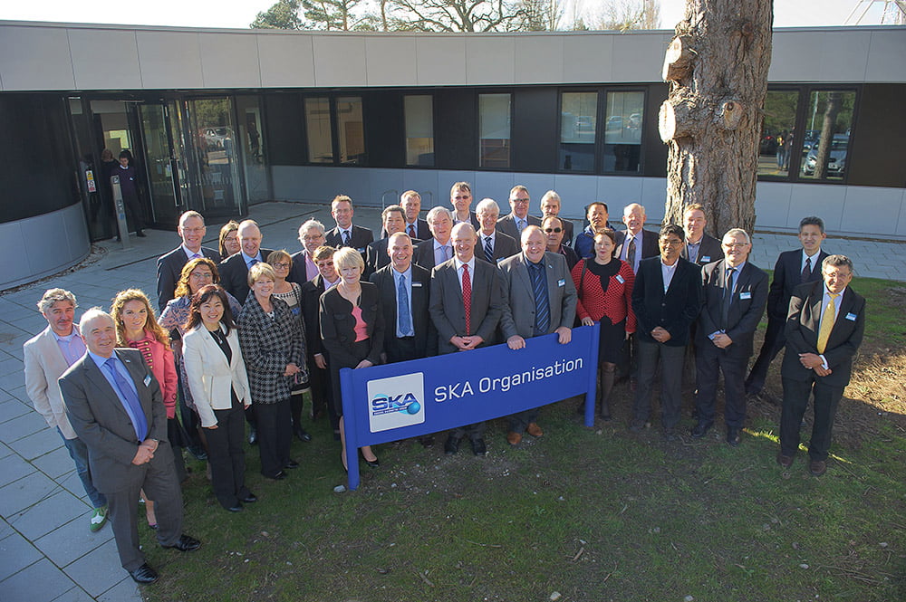 UK Science Minister David Willetts and the full SKA Board at the SKA Organisation Headquarters at Jodrell Bank Observatory, after announcing £100M in funding from the UK for the SKA telescope. Credit: SKA Organisation. 