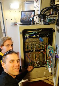 David Gozzard and Sascha Schediwy inspecting the modifications to the Compact Array receivers. Credit Jock McFee.