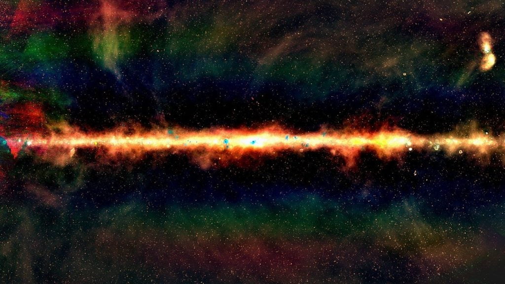 The GLEAM view of the centre of the Milky Way, in radio colour. Red indicates the lowest frequencies, green indicates the middle frequencies, and blue indicates the highest frequencies. Each dot is a galaxy, with around 300,000 radio galaxies observed as part of the GLEAM survey: Natasha Hurley-Walker (Curtin / ICRAR) and the GLEAM Team