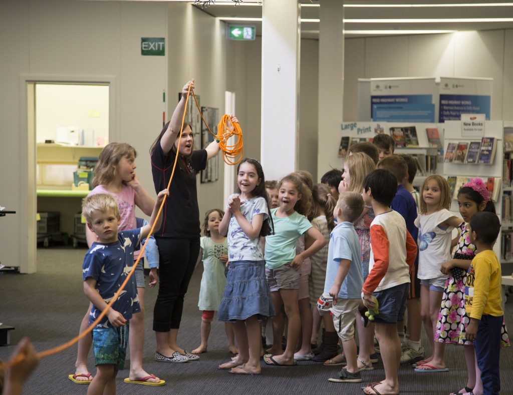 ICRAR PhD Candidate and high school teacher Ms Sarah Bruzzese teaching children about the Solar System at a local library. Credit: ICRAR.