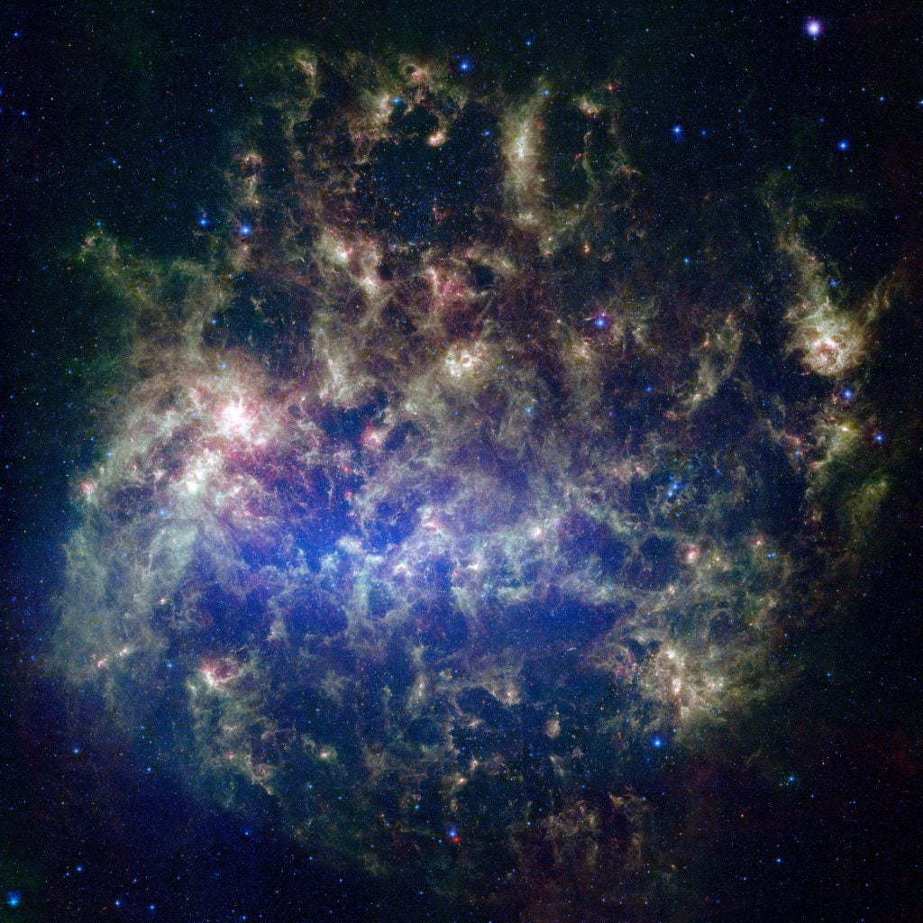 This vibrant image from NASA's Spitzer Space Telescope shows the Large Magellanic Cloud, a satellite galaxy to our own Milky Way galaxy. Credit: NASA/JPL-Caltech/M. Meixner (STScI) & the SAGE Legacy Team.