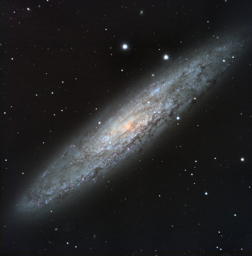 The barred spiral galaxy NGC 253 is 11.5 million light-years from Earth and the brightest member of the Sculptor group of galaxies. The galaxy appears elongated as we see it from an edge-on perspective and dark dust patches conceal much of its spiral structure, also masking the HII regions. Credit: Paul Luckas, ICRAR/UWA/SPIRIT.