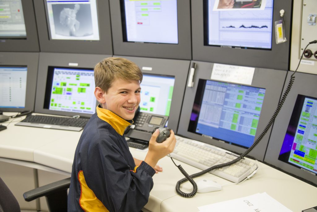 Student Matthew Maliszewski prepares to start the countdown for ESA operations in Germany to release his signal to Proxima Centauri.