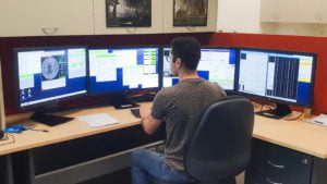 ICRAR PhD Candidate Hosein Hashemizadeh in the remote observing control room setting up for observing with the Anglo-Australian Telescope.