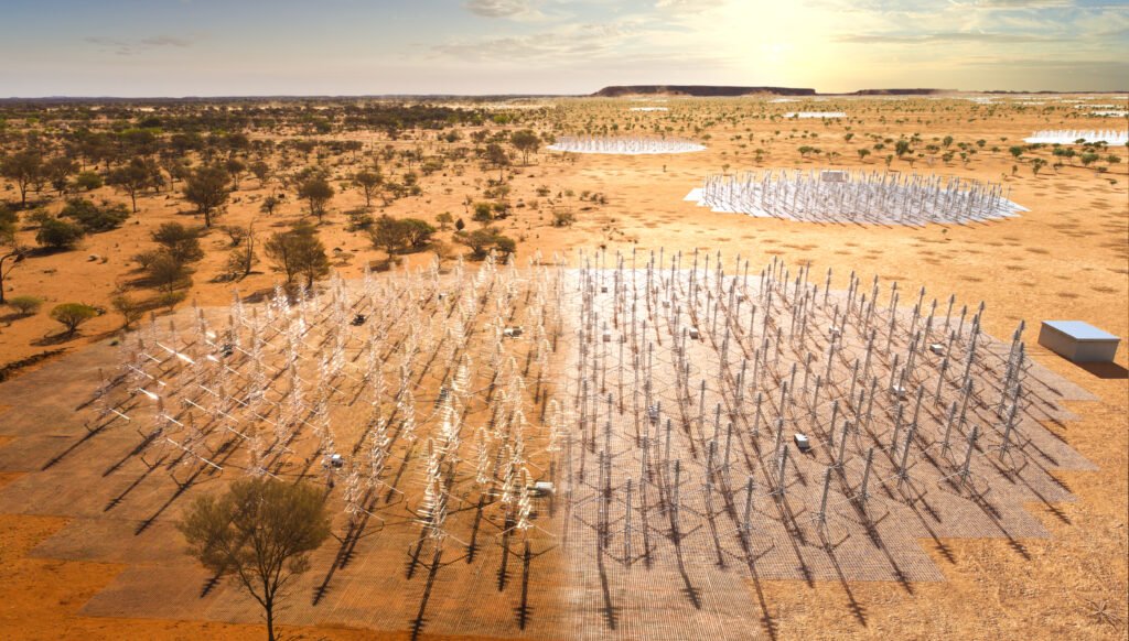 Composite image of the SKA-Low telescope in Western Australia. The image blends a real photo (on the left) of the SKA-Low prototype station AAVS2.0 which is already on site, with an artists impression of the future SKA-Low stations as they will look when constructed. These dipole antennas, which will number in their hundreds of thousands, will survey the radio sky in frequencies as low at 50Mhz.