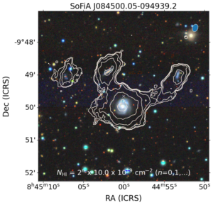 Four nearby galaxies as part of the set of 49 found by MeerKAT, shown by the white contours. Three of the galaxies are connected together by their gas content. The largest galaxy is stealing gas from two neighbouring galaxies. The background colour image is from the DECaLS DR10 optical survey. Glowacki et al. 2024