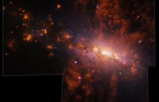 A giant galactic explosion catches galaxy pollution in the act